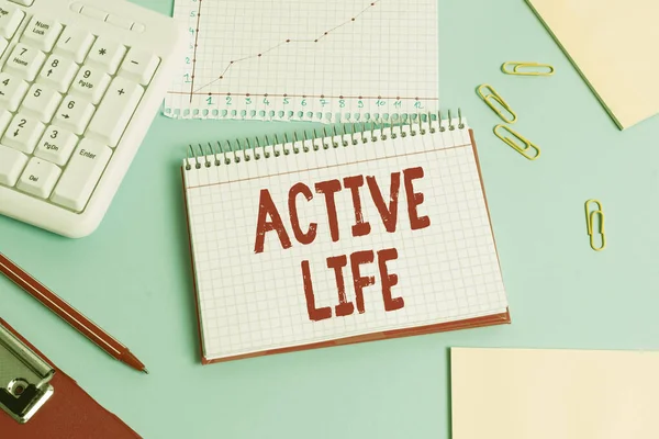 Handwriting text Active Life. Concept meaning way of life that integrates physical activity into your everyday Paper blue desk computer keyboard office study notebook chart numbers memo. — 스톡 사진