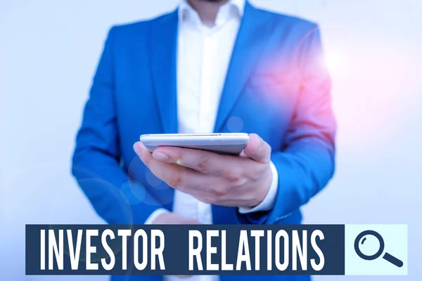 Writing note showing Investor Relations. Business photo showcasing analysisagement responsibility that integrates finance Business concept with man holding mobile phone with touch screen. — Stockfoto