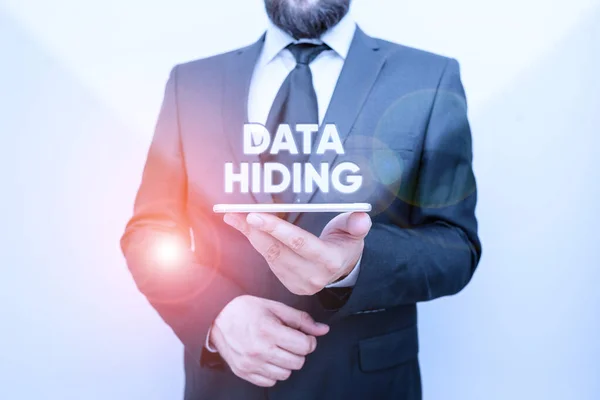 Word writing text Data Hiding. Business concept for Secretly embedding data in graphics images and other file types Male human wear formal work suit hold smart hi tech smartphone use one hand.