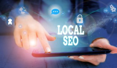 Writing note showing Local Seo. Business photo showcasing helps businesses promote products and services to local customers Picture photo network scheme with modern smart device.