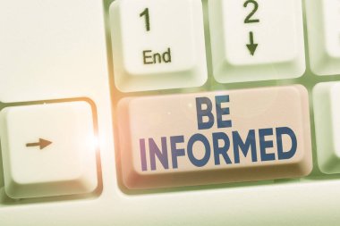 Handwriting text Be Informed. Concept meaning having or showing knowledge of a subjects or situations White pc keyboard with empty note paper above white background key copy space.