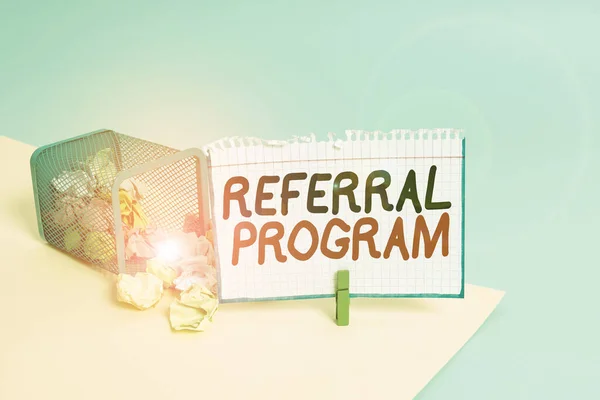 Word writing text Referral Program. Business concept for employees are rewarded for introducing suitable recruits Trash bin crumpled paper clothespin empty reminder office supplies tipped.