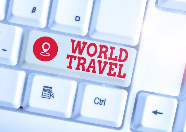 Conceptual hand writing showing World Travel. Business photo text the movement of showing between distant geographical locations White pc keyboard with note paper above the white background. — Stock Photo, Image