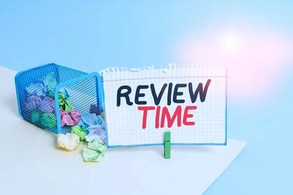 Word writing text Review Time. Business concept for to think or talk about something again Set schedule to review Trash bin crumpled paper clothespin empty reminder office supplies tipped.