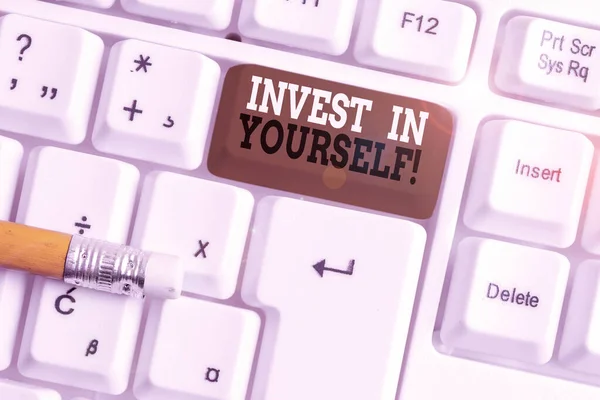 Text sign showing Invest In Yourself. Conceptual photo nvesting in a coach or a training to learn new things White pc keyboard with empty note paper above white background key copy space. — Stock Photo, Image
