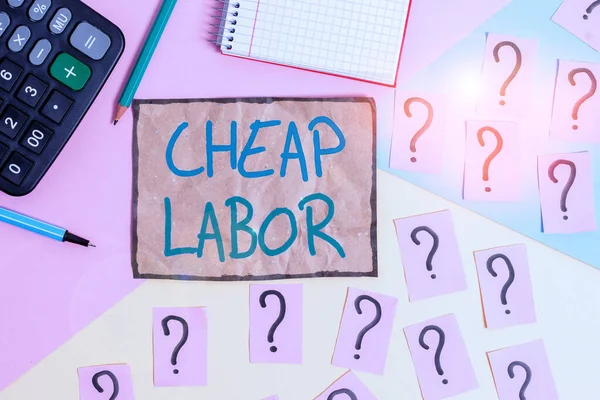 Writing note showing Cheap Labor. Business photo showcasing when a demonstrating works hard in bad conditions and very little money Mathematics stuff and writing equipment above pastel colours backgro