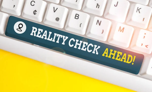 Writing note showing Reality Check Ahead. Business photo showcasing makes them recognize truth about situations or difficulties White pc keyboard with note paper above the white background. — Stock Photo, Image