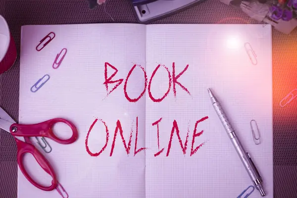 Text sign showing Book Online. Conceptual photo booklike form that is only available to read on the Internet Scissors and writing equipments plus math book above textured backdrop. — 图库照片