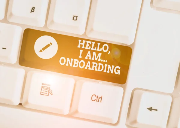 Text sign showing Hello I Am Onboarding. Conceptual photo telling demonstrating that you are on ship or plane White pc keyboard with empty note paper above white background key copy space. — ストック写真