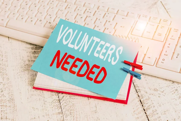 Writing note showing Volunteers Needed. Business photo showcasing need work or help for organization without being paid notebook reminder clothespin with pinned sheet light wooden. — Stockfoto