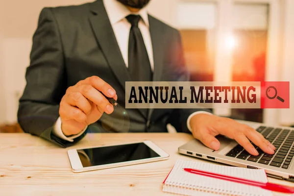 Conceptual hand writing showing Annual Meeting. Business photo text yearly meeting of the general membership of an organization Male human wear formal clothes present use hitech smartphone.