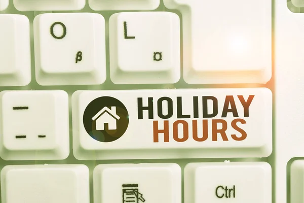 Word writing text Holiday Hours. Business concept for employee receives twice their normal pay for all hours White pc keyboard with empty note paper above white background key copy space.