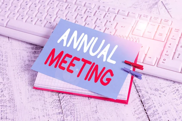 Writing note showing Annual Meeting. Business photo showcasing yearly meeting of the general membership of an organization notebook reminder clothespin with pinned sheet light wooden.