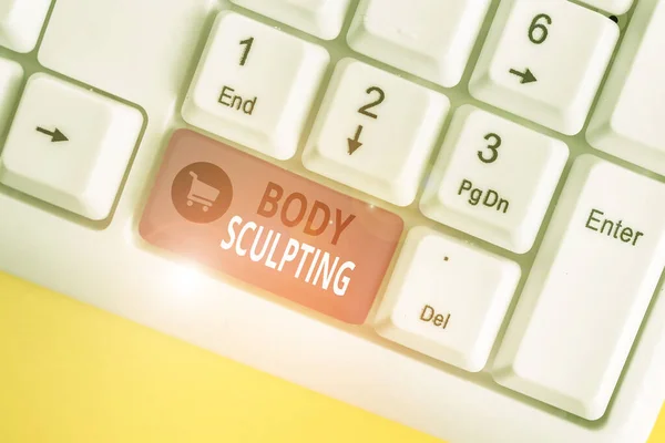 Handwriting text Body Sculpting. Concept meaning activity of increasing the body s is visible muscle tone White pc keyboard with empty note paper above white background key copy space.