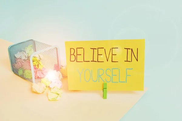 Handwriting text Believe In Yourself. Concept meaning common piece of advice that you can do everything Trash bin crumpled paper clothespin empty reminder office supplies tipped.