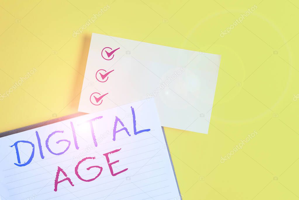 Conceptual hand writing showing Digital Age. Business photo text introduction of the demonstratingal computer with subsequent technology Empty orange paper with copy space on the yellow table.