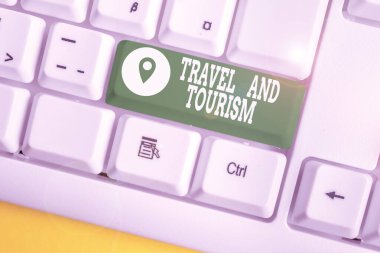 Writing note showing Travel And Tourism. Business photo showcasing Temporary Movement of People to Destinations or Locations White pc keyboard with note paper above the white background.