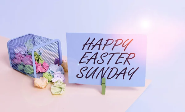 Writing note showing Happy Easter Sunday. Business photo showcasing Greeting someone about holidays Spring is coming Trash bin crumpled paper clothespin reminder office supplies.