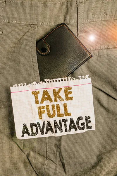 Writing note showing Take Full Advantage. Business photo showcasing Utilize someone or something to the fullest extent Small wallet inside trouser front pocket near notation paper. — Stock Photo, Image