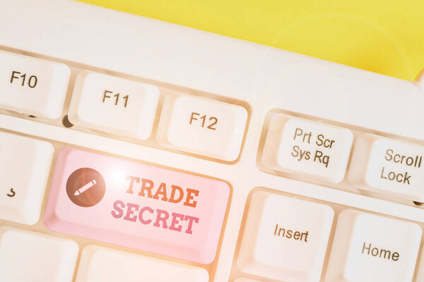 Writing note showing Trade Secret. Business photo showcasing technique used by a company in analysisufacturing its products White pc keyboard with note paper above the white background.