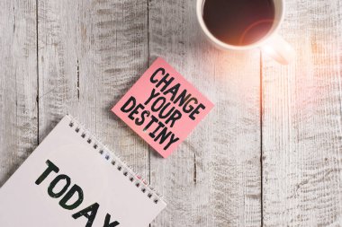 Word writing text Change Your Destiny. Business concept for Rewriting Aiming Improving Start a Different Future Stationary placed next to a cup of black coffee above the wooden table.