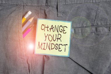 Text sign showing Change Your Mindset. Conceptual photo replace your beliefs way of thinking mental path Writing equipment and green note paper inside pocket of man work trousers. clipart