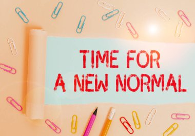 Writing note showing Time For A New Normal. Business photo showcasing Make a big dramatic change Replace the expected Stationary and torn cardboard placed above plain pastel table backdrop. clipart