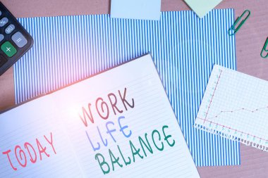 Handwriting text writing Work Life Balance. Concept meaning Division of time between working or family and leisure Striped paperboard notebook cardboard office study supplies chart paper.