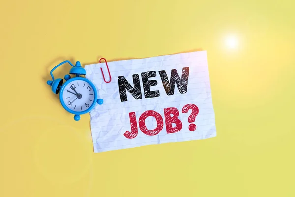 Text sign showing New Job Question. Conceptual photo asking if a demonstrating got regular work to earn money Metal alarm clock clip blank crushed note sheet colored background.