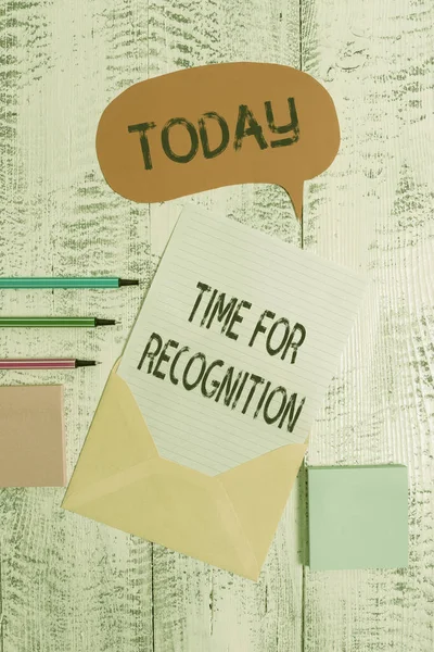 Writing note showing Time For Recognition. Business photo showcasing Acknowledgement Interval between Stimulus and Nature Envelop speech bubble paper sheet ballpoints notepads wooden background.