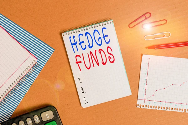 Handwriting text writing Hedge Funds. Concept meaning basically a fancy name for an alternative investment partnership Striped paperboard notebook cardboard office study supplies chart paper.