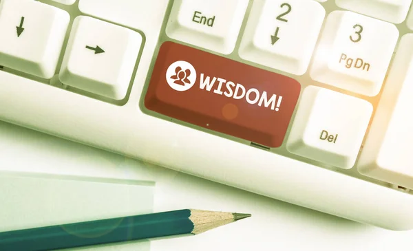 Writing note showing Wisdom. Business photo showcasing the ability to use your knowledge and experience to make decisions White pc keyboard with note paper above the white background.