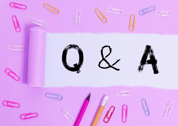 Writing note showing Q And A. Business photo showcasing a period of time or an occasion when someone answers questions Stationary and torn cardboard on a wooden classic table backdrop. — 图库照片