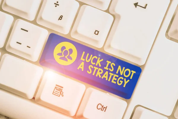 Handwriting text writing Luck Is Not A Strategy. Concept meaning it is not being Lucky when planned intentionally White pc keyboard with empty note paper above white background key copy space. — Stok fotoğraf