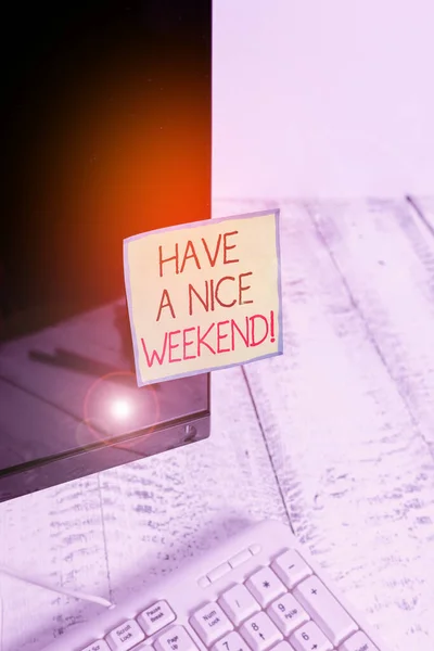 Handwriting text Have A Nice Weekend. Concept meaning wishing someone that something nice happen holiday Notation paper taped to black computer monitor screen near white keyboard.