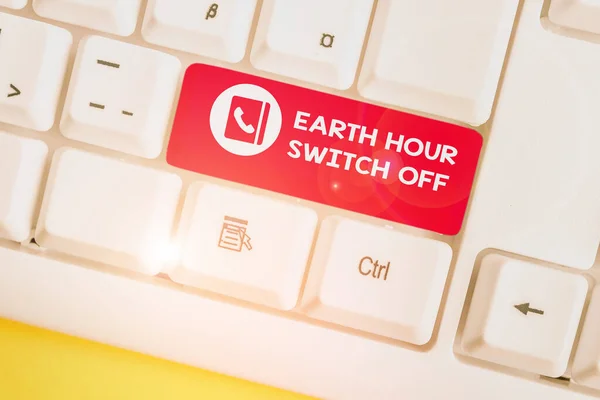 Написання тексту Earth Hour Switch. Концепт означає Щорічну клавіатуру "The Lights Out Event Annual Movement Planet Day White pc" з порожньою нотаткою над простором копіювання ключів білого фону.. — стокове фото