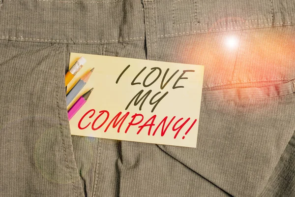 Writing note showing I Love My Company. Business photo showcasing tell why admire their job and workplace Writing equipment and yellow note paper inside pocket of man trousers. — Stockfoto