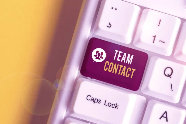 Text sign showing Team Contact. Conceptual photo The interaction of the individuals on a team or group White pc keyboard with empty note paper above white background key copy space. — Stok fotoğraf