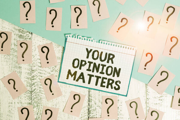 Writing note showing Your Opinion Matters. Business photo showcasing to Have your say Providing a Valuable Input to Improve Scribbled and crumbling papers with thick cardboard above wooden table.