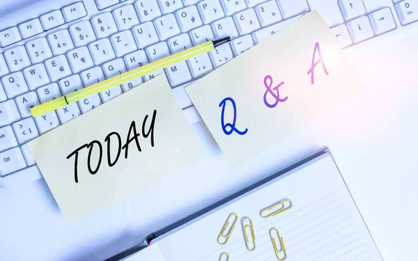 Conceptual hand writing showing Q And A. Business photo text a period of time or an occasion when someone answers questions Empty orange square papers by the pc keyboard with copy space. — Stockfoto