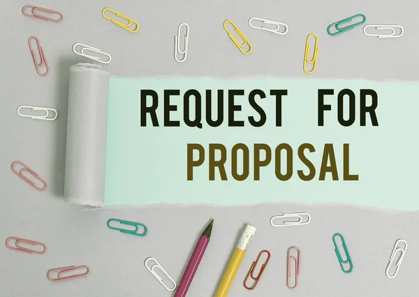Writing note showing Request For Proposal. Business photo showcasing document contains bidding process by agency or company Stationary and torn cardboard on a wooden classic table backdrop.