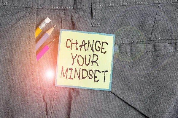 Text sign showing Change Your Mindset. Conceptual photo replace your beliefs way of thinking mental path Writing equipment and green note paper inside pocket of man work trousers.