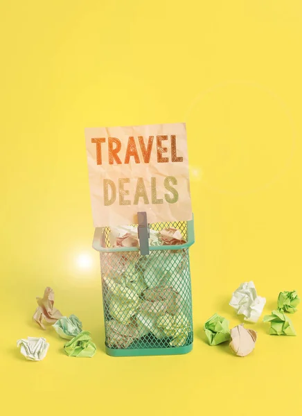 Handwriting text writing Travel Deals. Concept meaning holiday organized by a travel company and pay fixed price Trash bin crumpled paper clothespin empty reminder office supplies yellow.