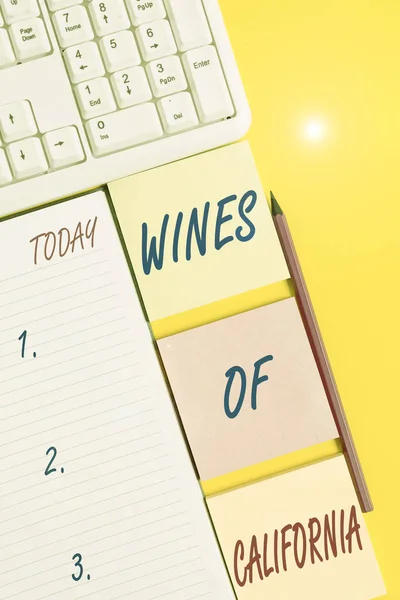 Text sign showing Wines Of California. Conceptual photo Best Winemakers in the USA Export Quality Beverage Empty papers with copy space on the yellow background table. — Stock Photo, Image