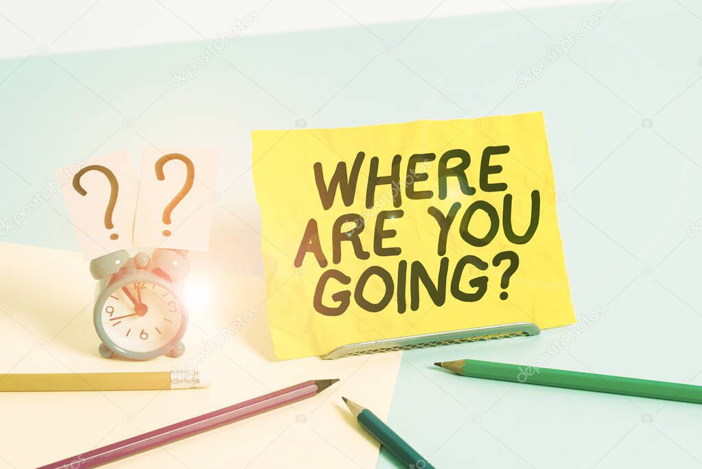 Text sign showing Where Are You Goingquestion. Conceptual photo used to ask someone the destination headed to Mini size alarm clock beside stationary placed tilted on pastel backdrop.