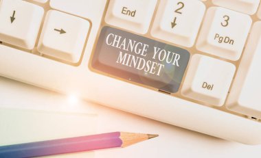 Conceptual hand writing showing Change Your Mindset. Business photo showcasing replace your beliefs way of thinking mental path White pc keyboard with note paper above the white background.