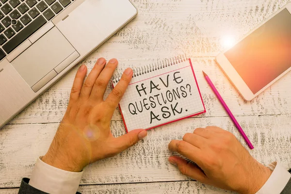 Writing note showing Have Questionsquestion Ask. Business photo showcasing something that you say or write to ask a demonstrating Hand hold note paper near writing equipment and smartphone. — Stockfoto