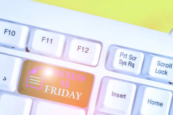 Writing note showing Tomorrow Is Friday. Business photo showcasing Weekend Happy holiday taking rest Vacation New week White pc keyboard with note paper above the white background. — Stock Photo, Image