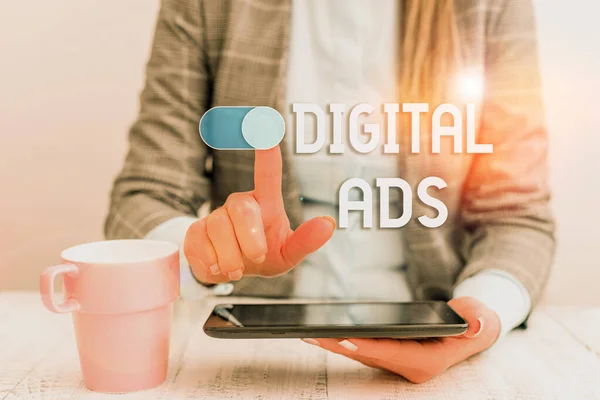 Text sign showing Digital Ads. Conceptual photo uses the Internet to deliver promotional marketing messages Business woman sitting with mobile phone and cup of coffee on the table.