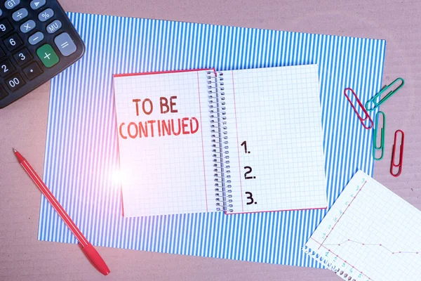 Text sign showing To Be Continued. Conceptual photo indicate that the story continues in the next episode Striped paperboard notebook cardboard office study supplies chart paper.